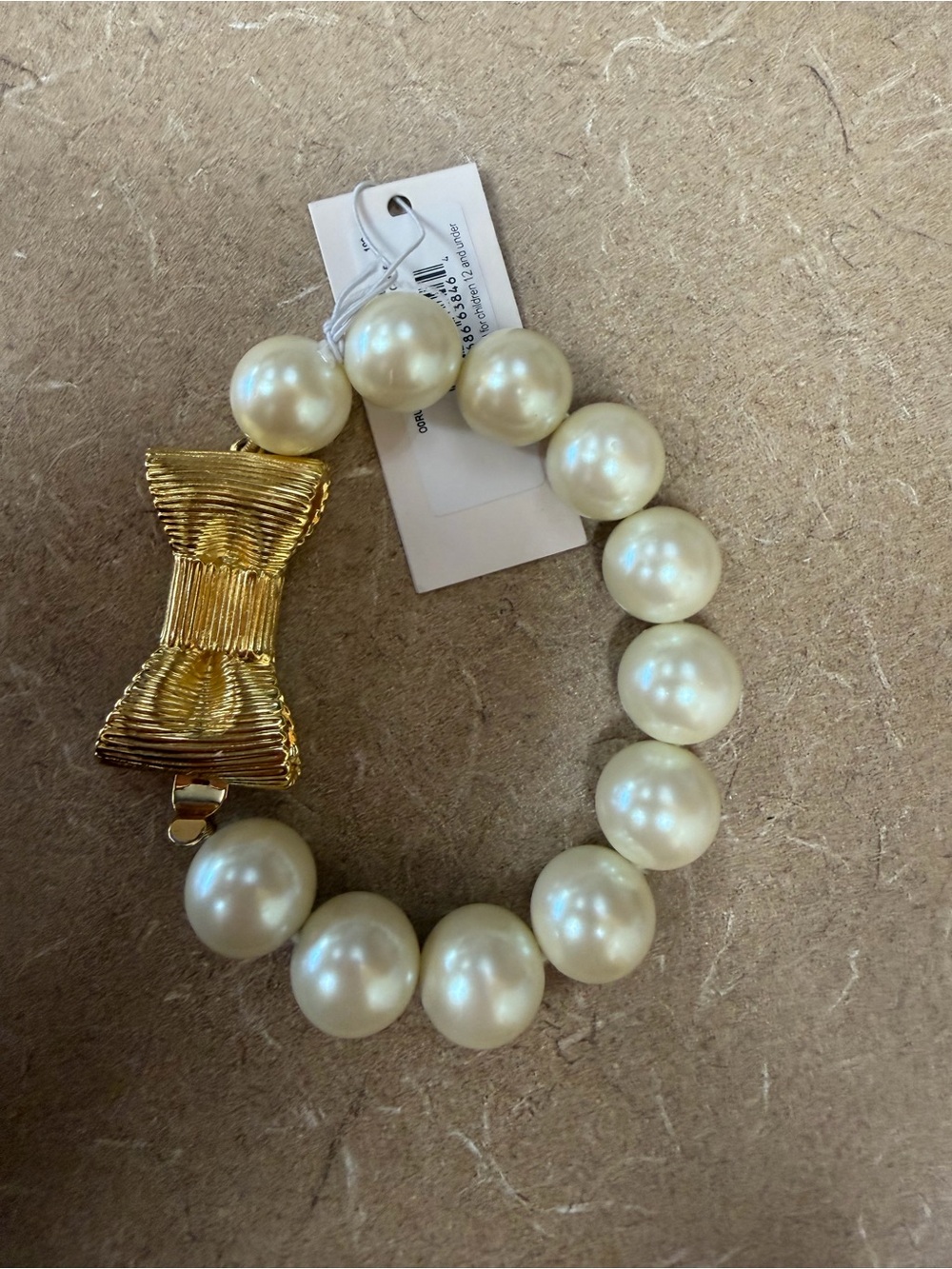 Kate Spade New York Faux Pearl Bow Bracelet Gold Tone